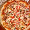 Pizza na ziołowym cienkim cieście (z szynką, papryką i pieczarkami). Przepis na dwie pizze 30 cm.
