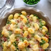 Gnocchi zapiekane z groszkiem, szynką speck i beszamelem
