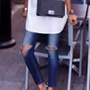Podarte jeansy w modzie