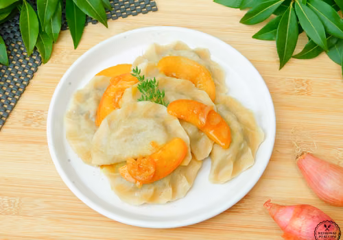 Pierogi z kaszanką i jabłkami duszonymi w cydrze