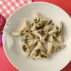 Pierogi z kaszą gryczaną polane masełkiem pietruszkowym