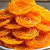 Te złociste spirale smakują jeszcze lepiej, niż wyglądają! Tradycyjne Jalebi – Słodkie i Chrupiące