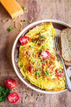 Ziołowy omlet z cheddarem i pomidorkami