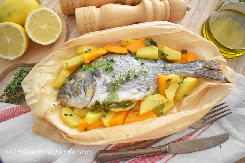 Dorada pieczona w pergaminie z ziemniakami i dynią