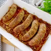 Biała kiełbasa pieczona z cebulą – prosty i sprawdzony przepis