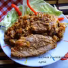 Karkówka pieczona w kapuście kiszonej z pieczarkami.