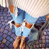 Podarte jeansy