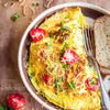 Ziołowy omlet z cheddarem i pomidorkami