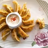 Pierogi z ciasta dyniowego nadziane dynią i słonym serem
