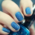 Niebieskie brokatowe paznokcie