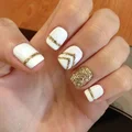 Biało złote paznokcie